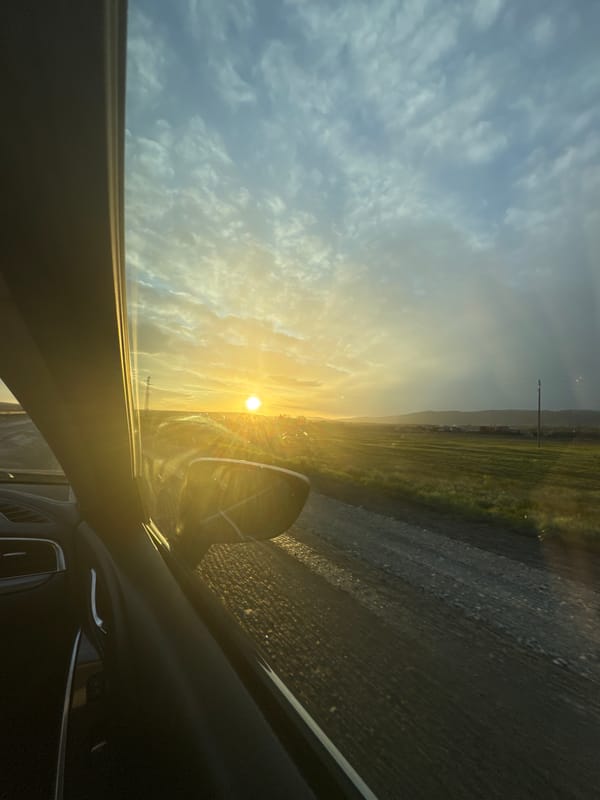 Driver captures sunset view through windshield in Aytos, Bulgaria