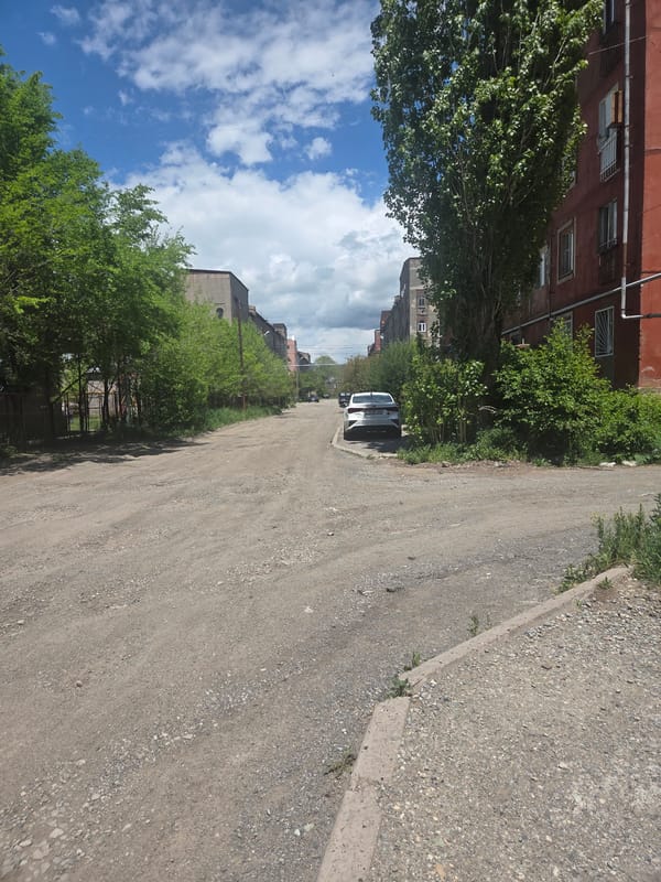 Gravel street scene captured in Gyumri residential area