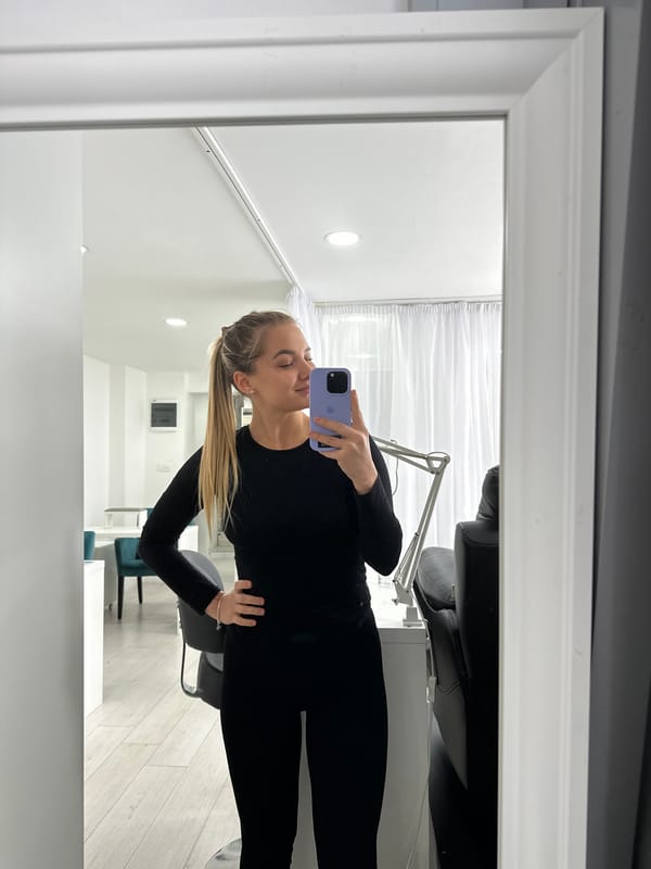 Woman takes selfies indoors in Budva, Montenegro