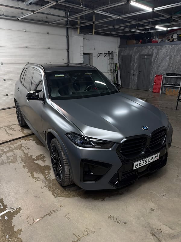 Car detailing facility busy with luxury vehicles in Krasnoyarsk