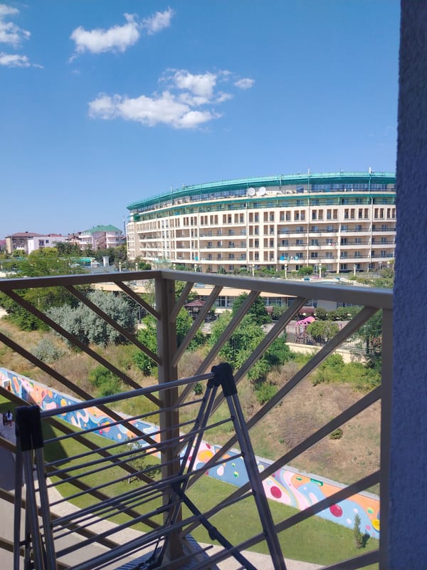 Balcony and aerial views around a sunny residential complex