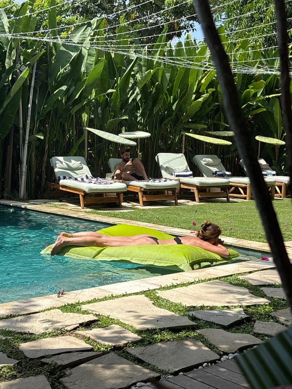 Couple enjoys morning pool time in Kuta Selatan