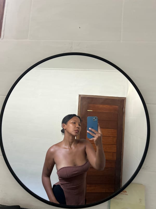 Mirror selfies and fresh fruit in a Kuta hotel room