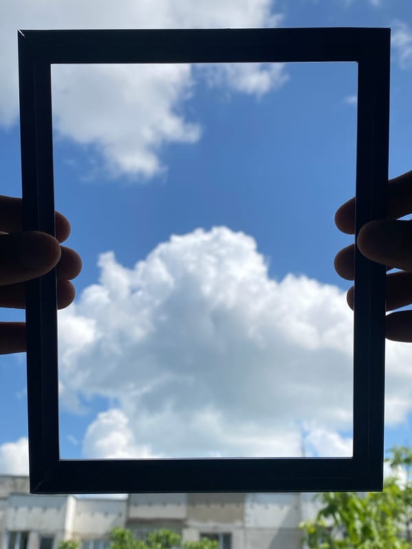 Person frames blue sky with clouds in Pleven