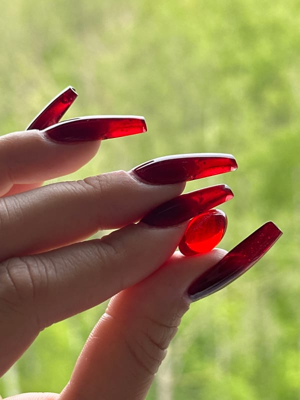 Red manicure photo session documented over two hours