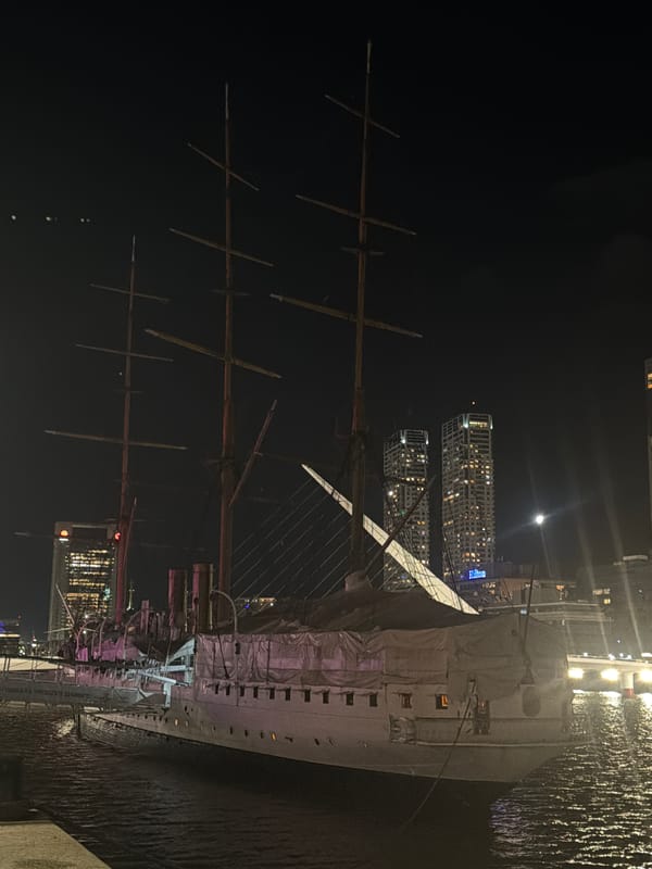 Illuminated sailing ship docked at night in Buenos Aires