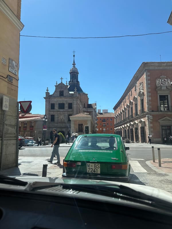 Tourist captures sunny Madrid drive past Almudena Cathedral