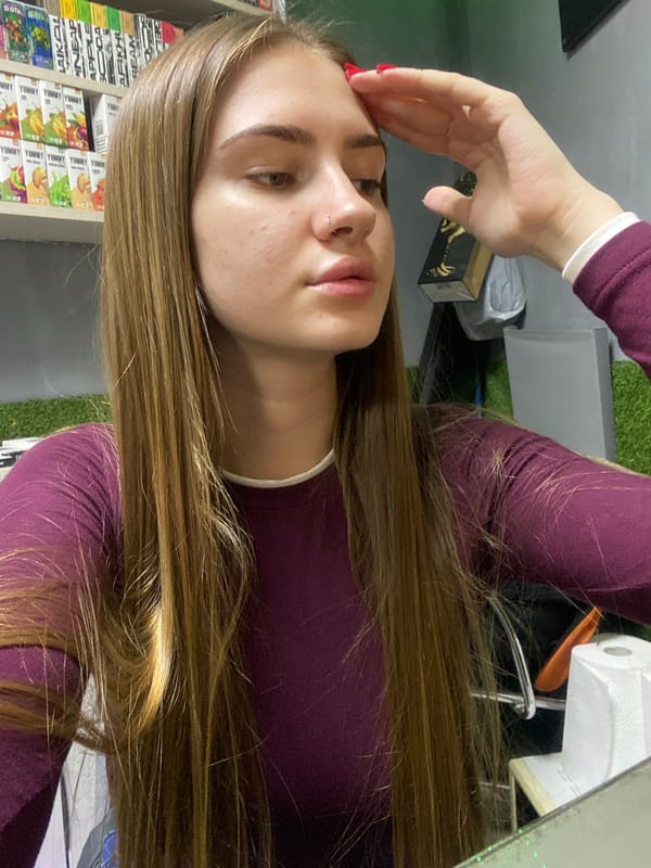 Young woman photographed in casual indoor session in Дьяково