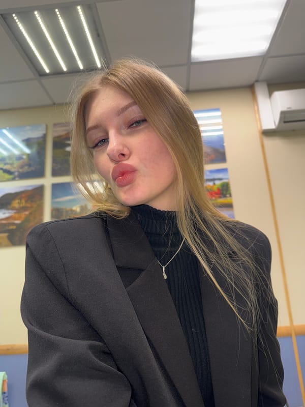 Woman photographed multiple times indoors in Perm, Russia