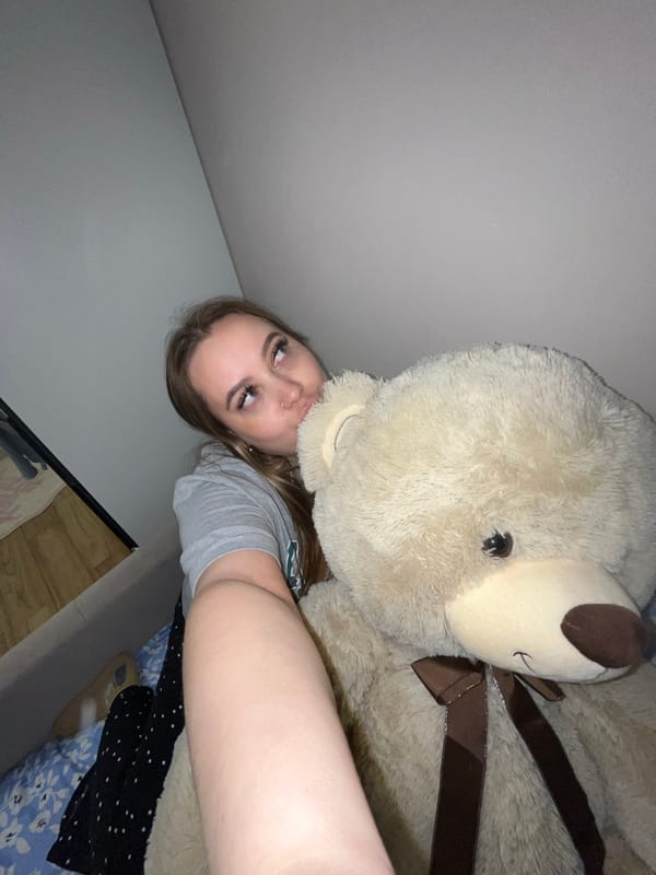 Woman poses with teddy bears in Krasnodar bedroom