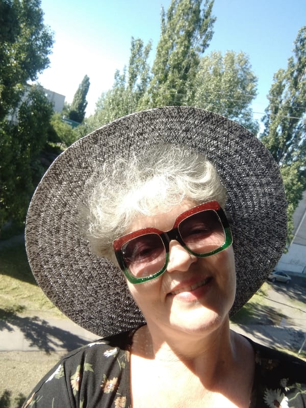 Woman takes selfies in bright morning sunlight in Ukraine