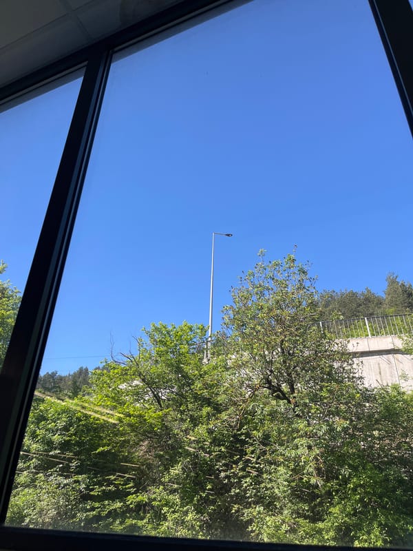 Clear Morning Sky View Captured Through Window in Smolyan