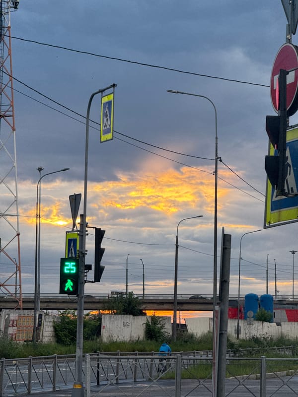 Saint Petersburg street glows under a vivid summer dusk sky