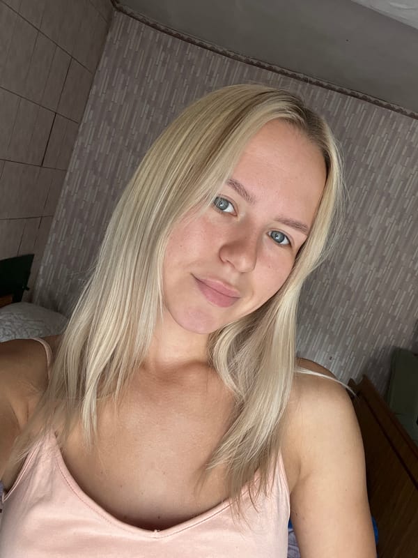 Quick selfie in a pink tank top, indoor setting