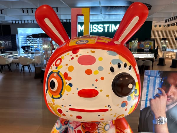 Shopper documents decorative displays at Macau mall