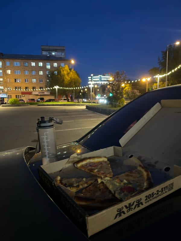 Pizza box photographed during evening hours in Krasnoyarsk