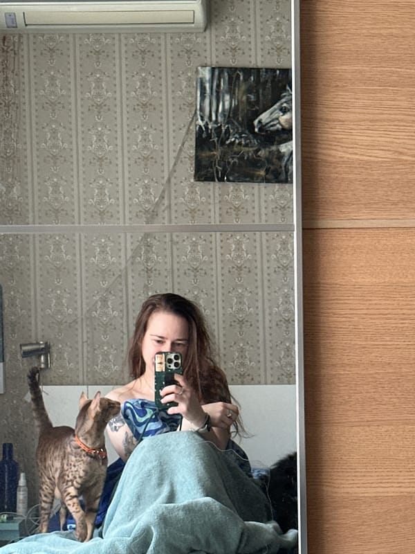 Moscow resident documents morning routine with Australian Shepherd and cat