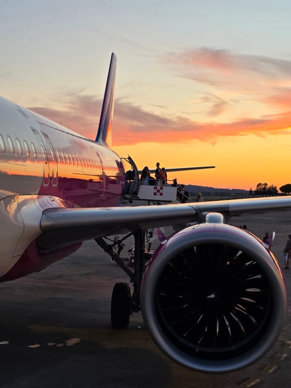 Boarding a passenger jet at sunset on the tarmac