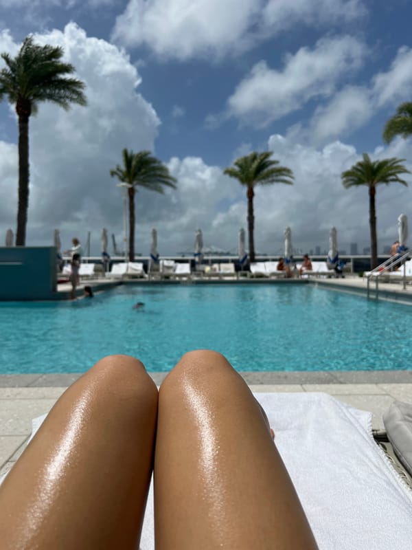 Beachgoers enjoy afternoon sun at Miami Beach pool area