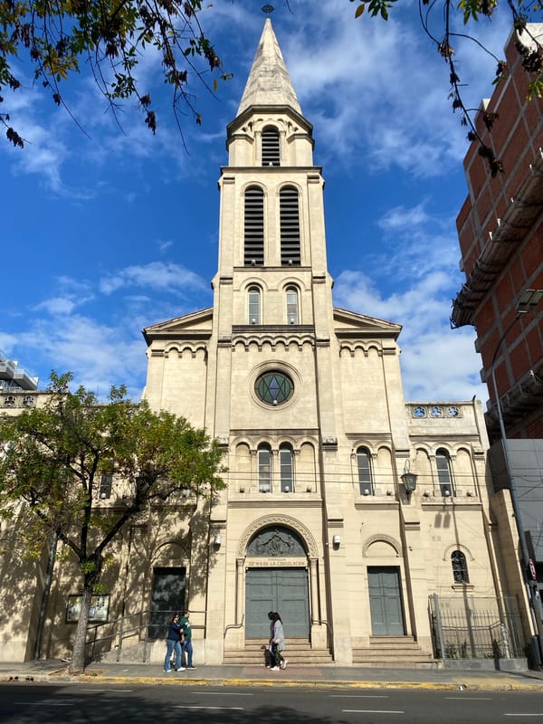 Multiple church buildings documented in Buenos Aires evening
