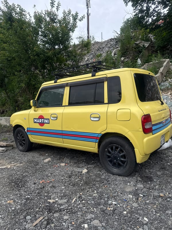 Yellow hatchback with Martini Racing livery parked in Vladivostok