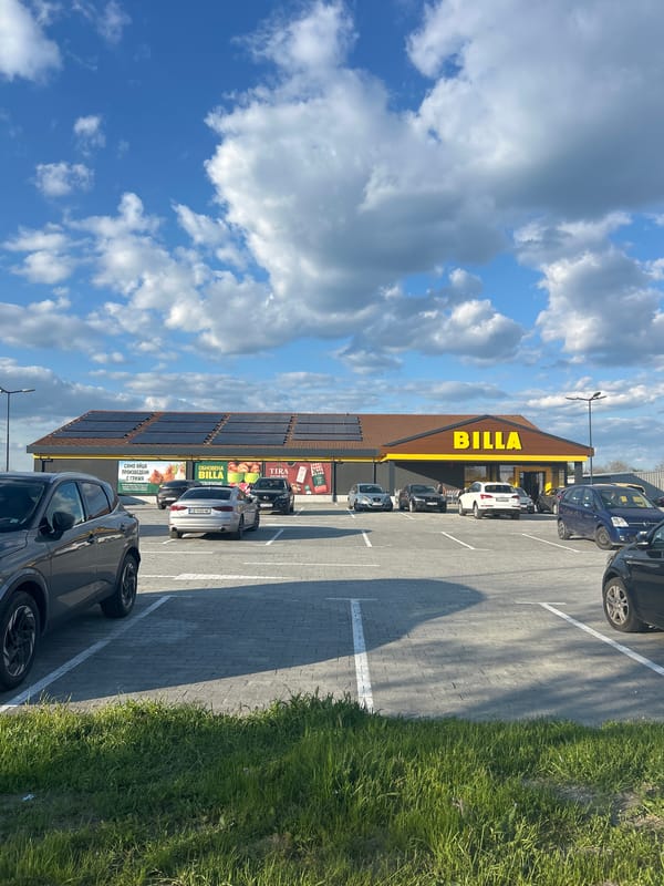 Billa supermarket observed under sunny skies in Pomorie, Bulgaria