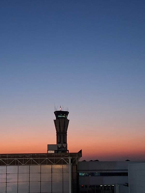 Tashkent Airport control tower at dusk, July 2026
