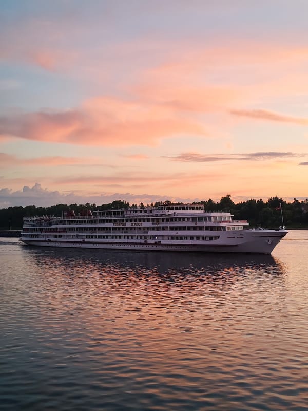 River cruise ship Georgy Zhukov glides through a Russian sunset