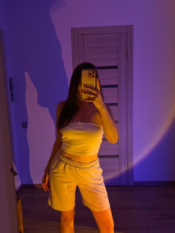 Mirror selfies and chill vibes in a purple-lit bedroom