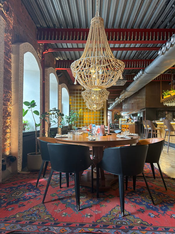 Woman photographed dining at upscale restaurant with Persian decor