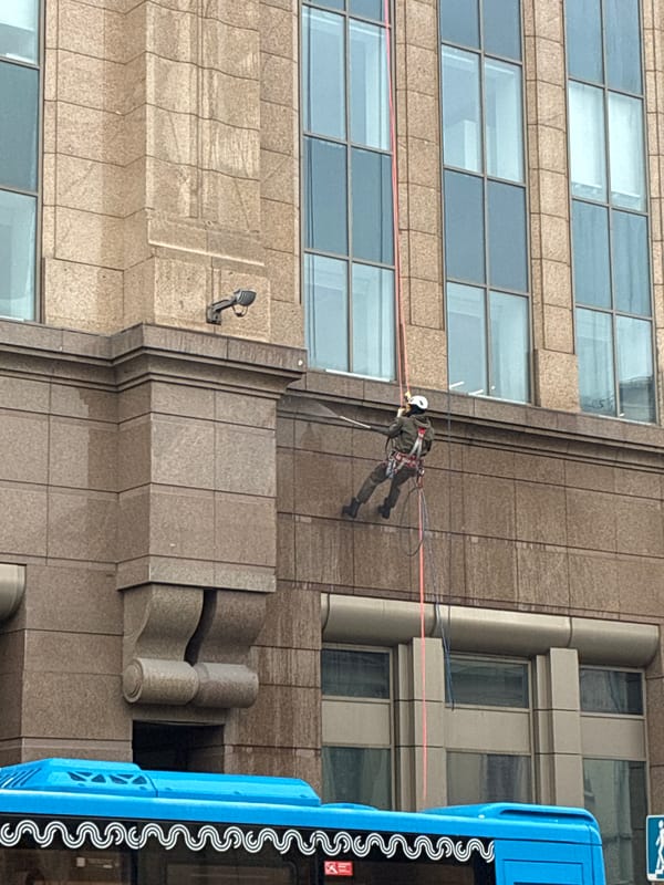 Ordinary Moscow moments: building maintenance, Kremlin views, subway musician