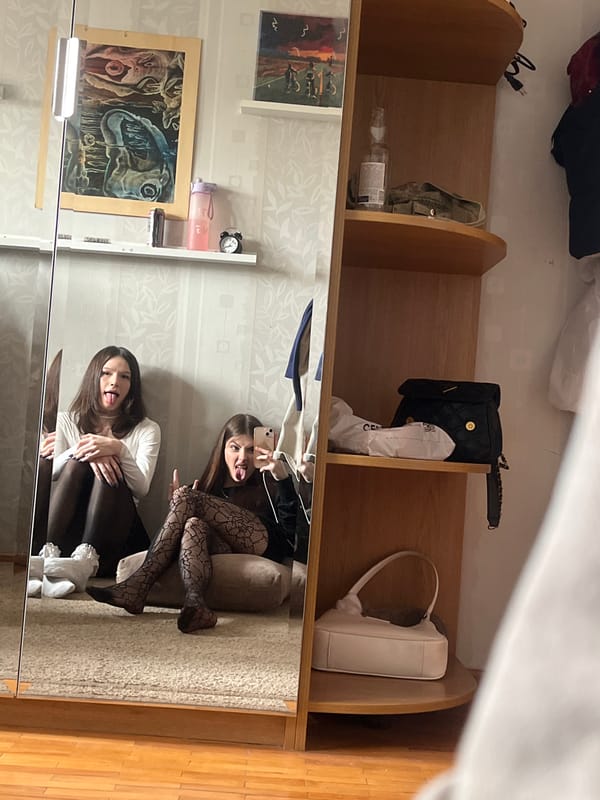 Women photographed wearing patterned fishnet stockings in Murino indoor setting