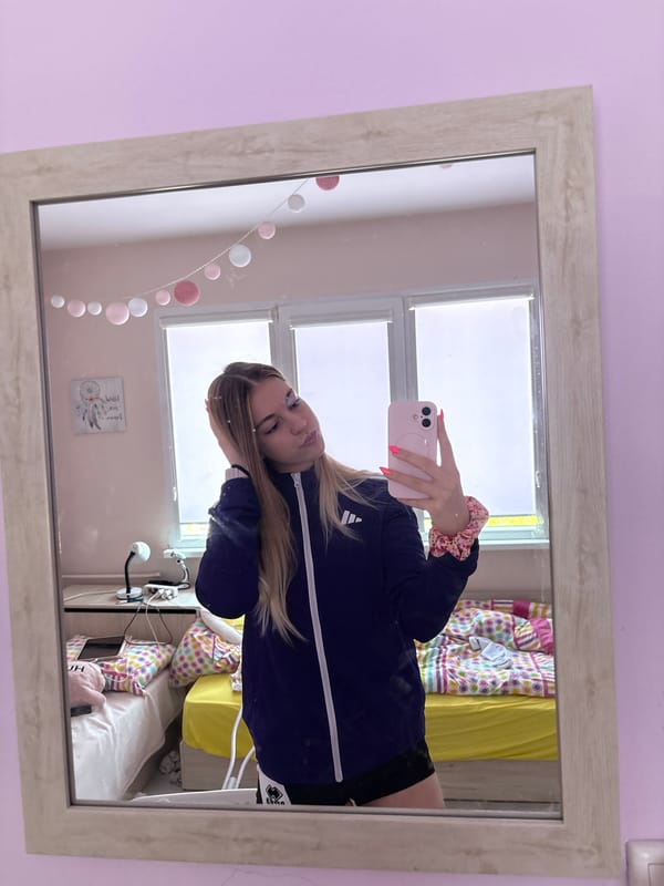 Woman takes mirror selfies in Sofia bedroom Friday morning