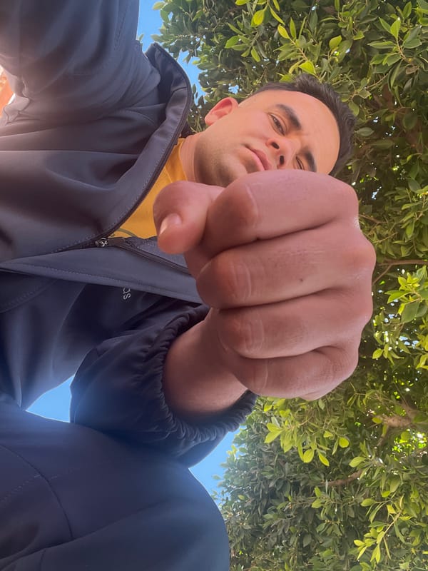 Young man poses with raised fist in Morocco