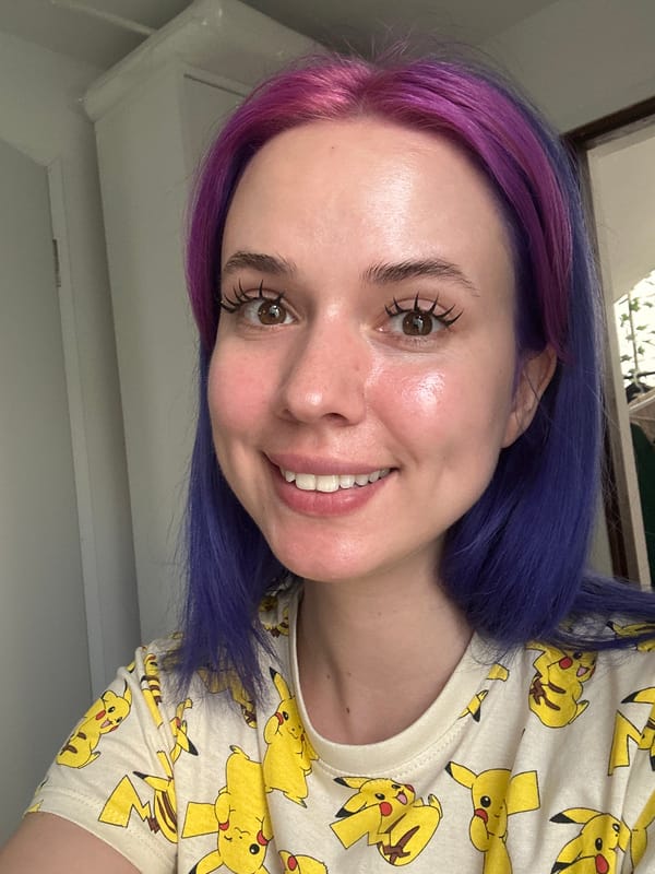 Woman with purple hair poses in Pikachu shirt in Zagreb