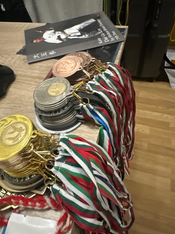 Person documents personal collection and fitness achievements indoors