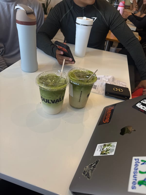 Young men share matcha drinks at Puebla cafe