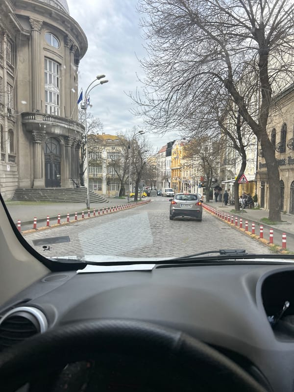 Morning traffic observed on cobblestone street in Varna, Bulgaria