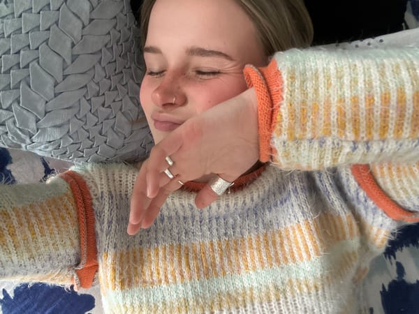 Person rests with hand over face in Whistler