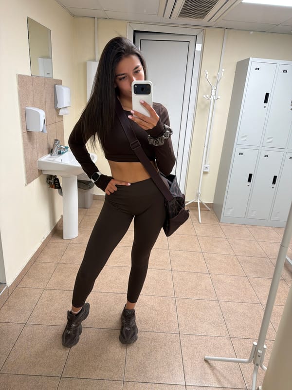 Locker room mirror selfie in a brown athletic set, Gabrovo