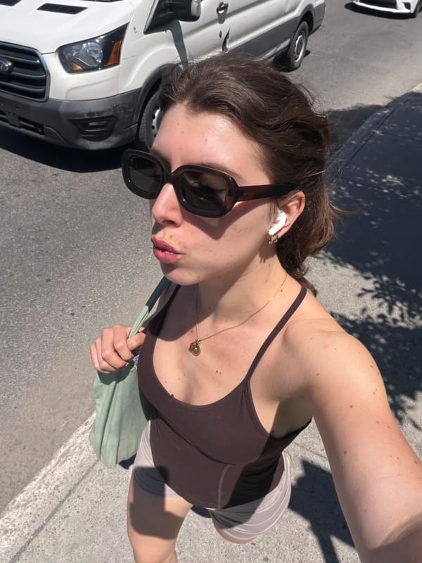 Woman photographed on sunny Montreal street afternoon