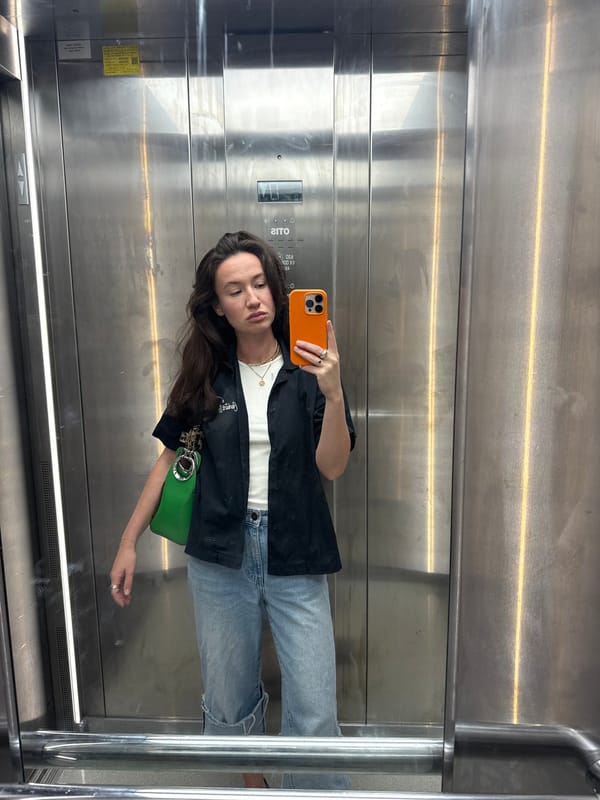 Woman takes elevator selfie in Tel Aviv early morning