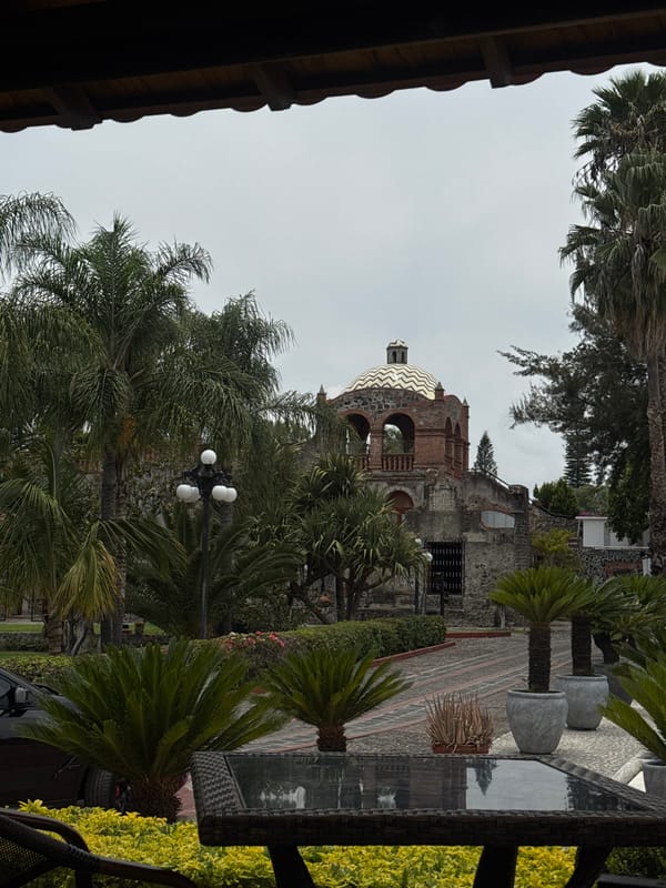Tourist dines at restaurant overlooking historic convent in Atlixco