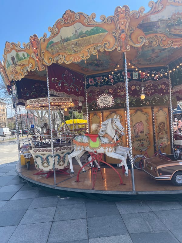 Spring morning scenes captured around illuminated carousel in Sofia