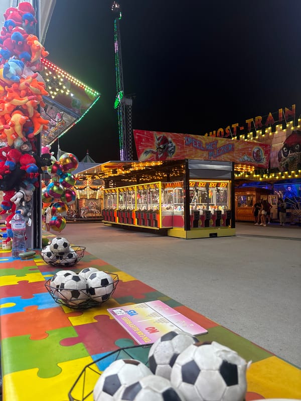 Night out at Varna's fairground, red roller coaster lit up