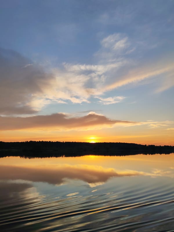 Sunset captured over water near Terekhovo, Russia
