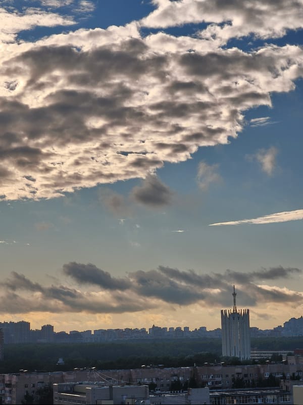 Saint Petersburg skyline at dusk, dramatic clouds overhead