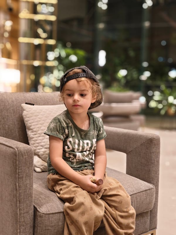 Child plays at nighttime playground in Mumbai