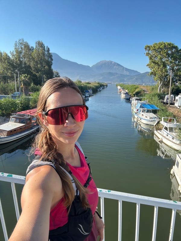 Morning selfie captured on Fethiye river bridge amid moored boats