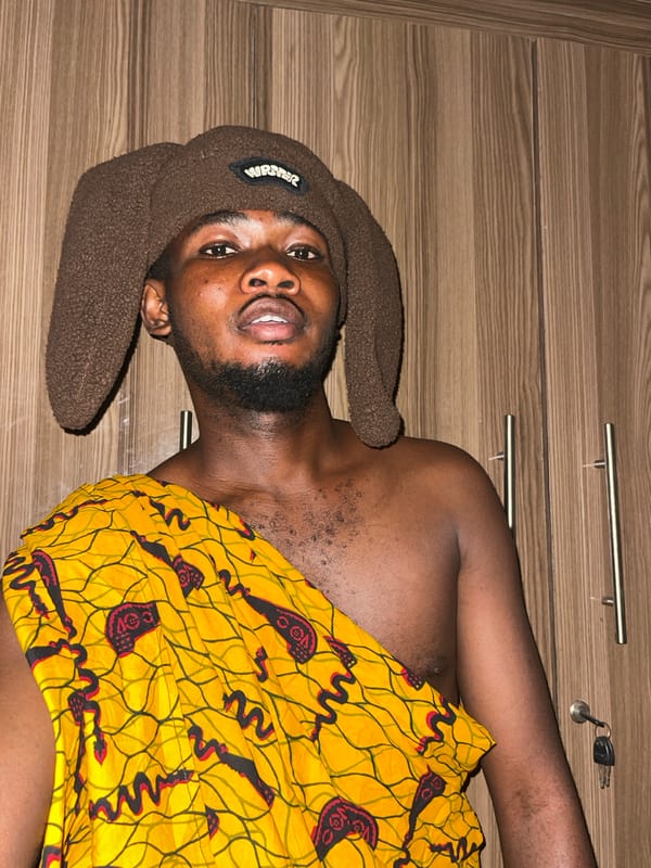 Young man photographed in casual indoor portraits in Nigeria